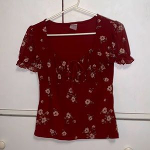 red blouse with white flowers